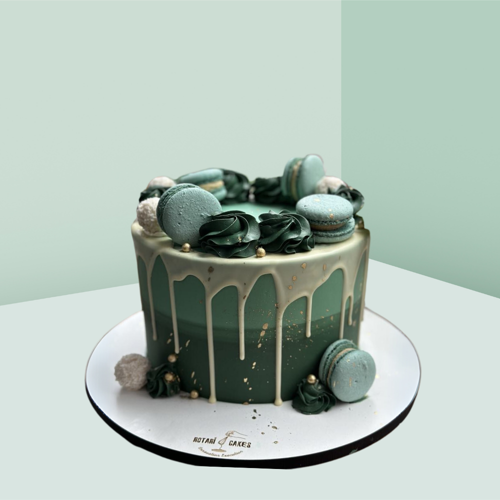 Ombre Cake in green colour with green macarons on it for birthdays and anniversaries