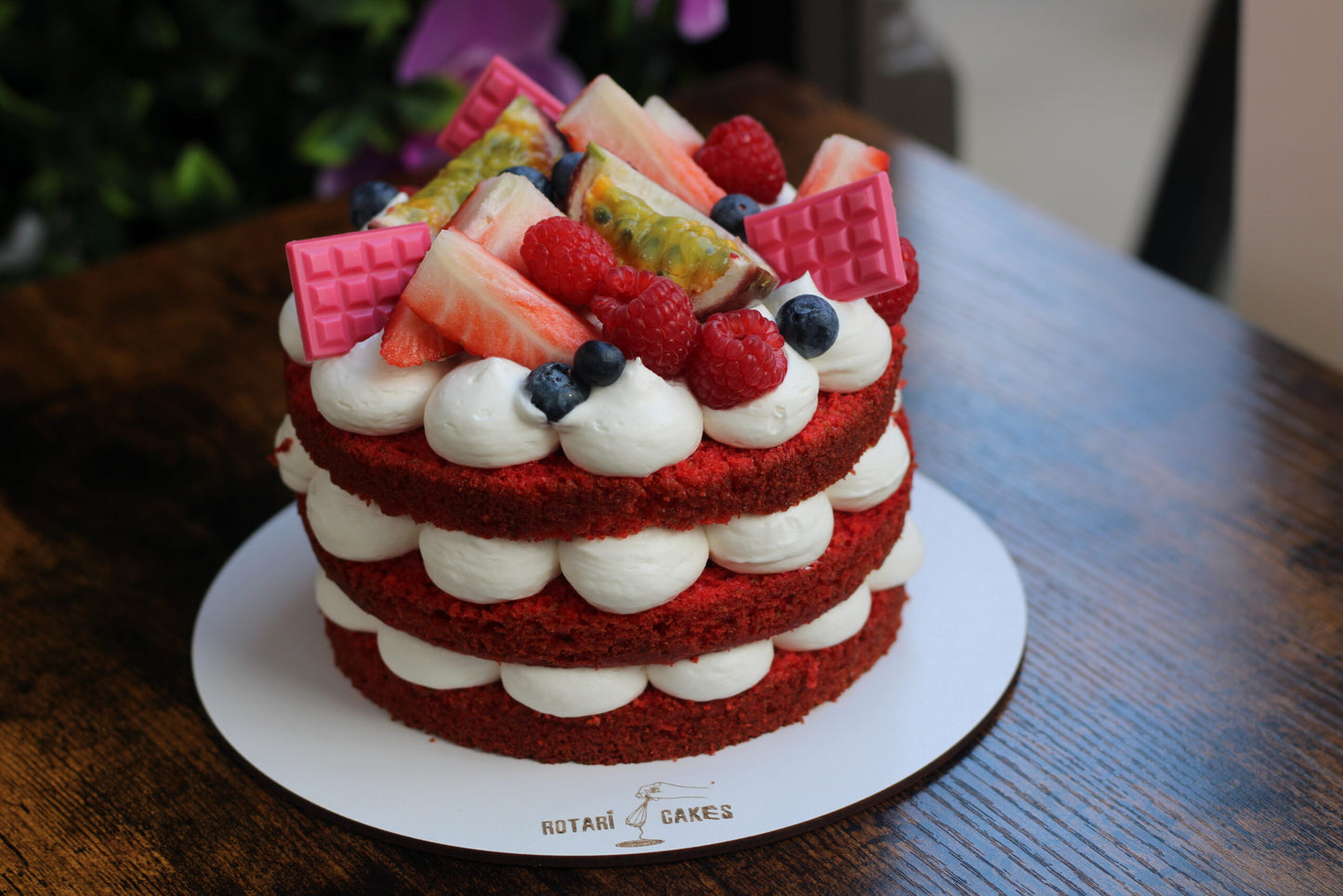 Naked Red Velvet Cake with creamy cream cheese frosting and exposed layers, ideal for birthdays and intimate celebrations.