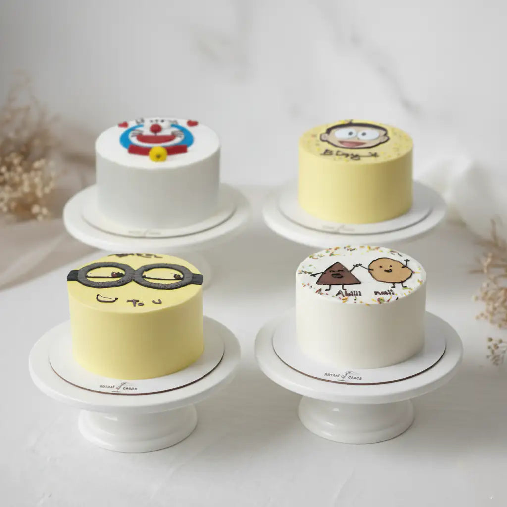 Four small cakes of minion with cartoon designs on white stands against a light background