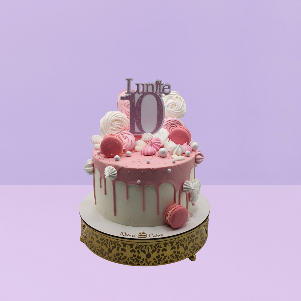Pink Chocolate Cake with macarons on top for girls birthdays 