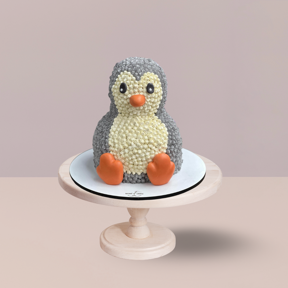Penguin Cake  featuring cute fondant penguin design. perfect for kids and birthdays