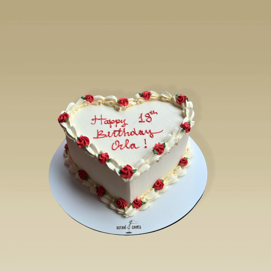 hart shape cake with red roses and custom writing for her birthday