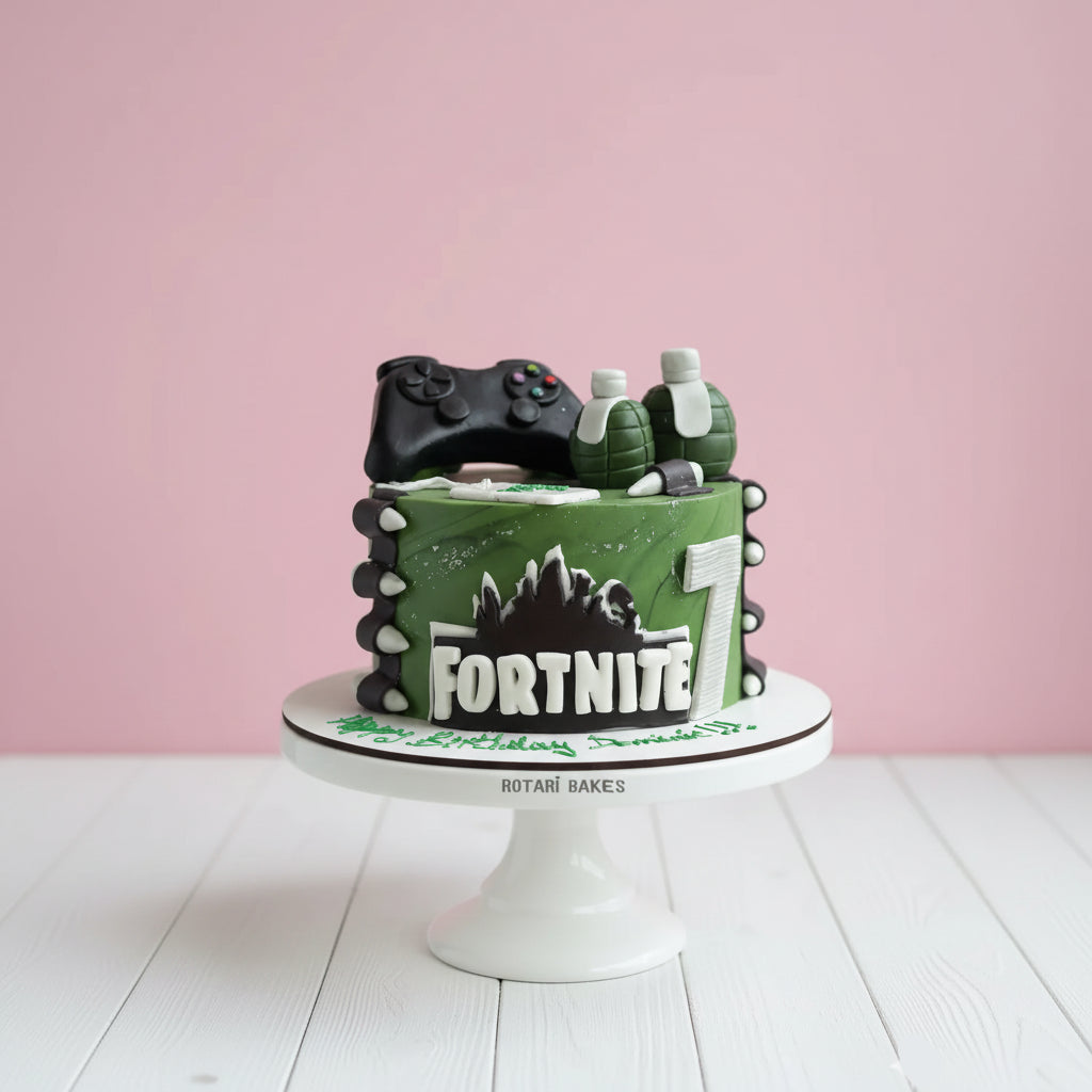 Fortnite theme cake for kids in green colour with fornite game elements, perfect for birthdays and theme parties