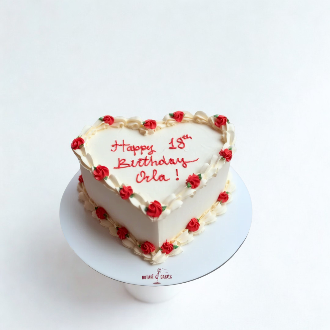 hart shape cake with red roses and custom writing for her birthday