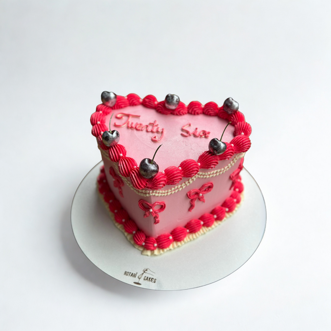 red & pink colour heart cake with cherries on top for girls