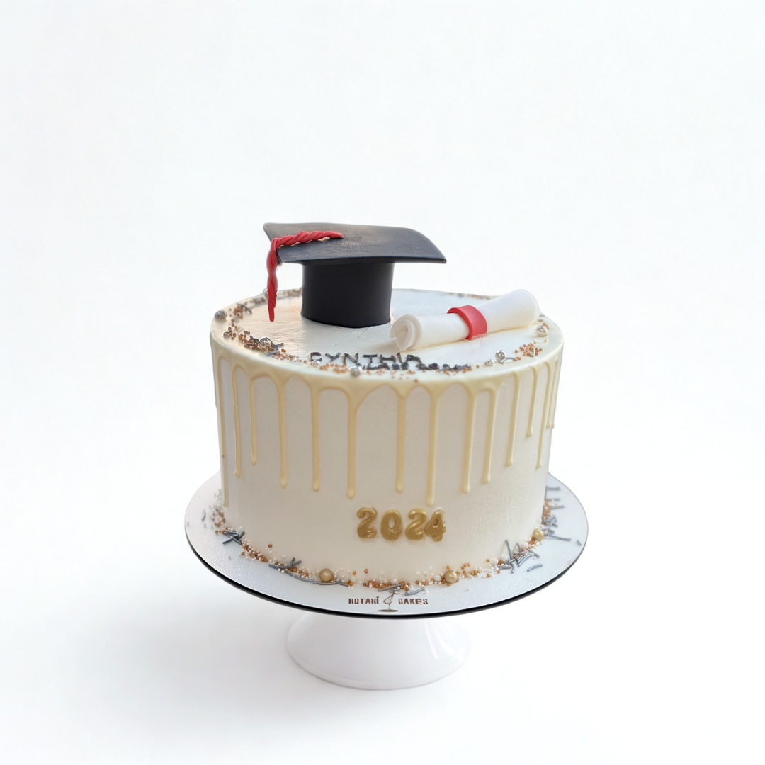 Graduation cake with hat and diploma on top with custom text