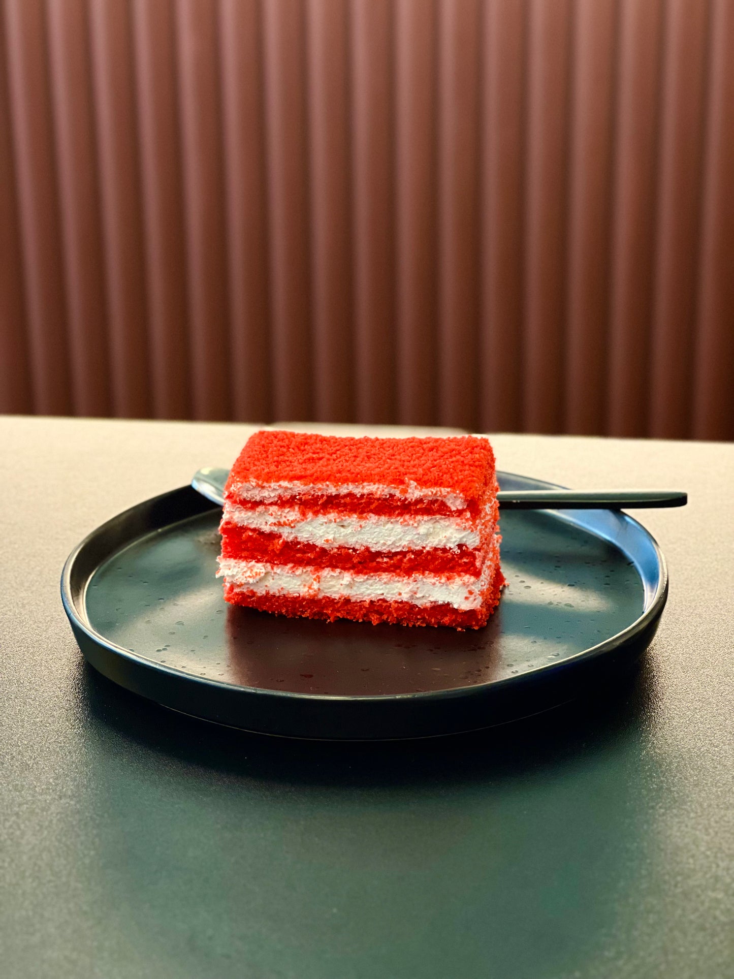 Red Velvet Slice Cake with deep red sponge, cream cheese and sour cream frosting, and a glossy jelly topping