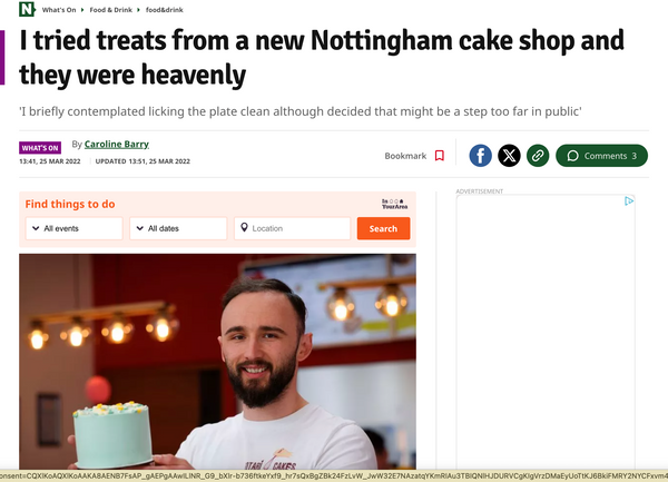 Article about rotari bakes shop with a man holding a cake.