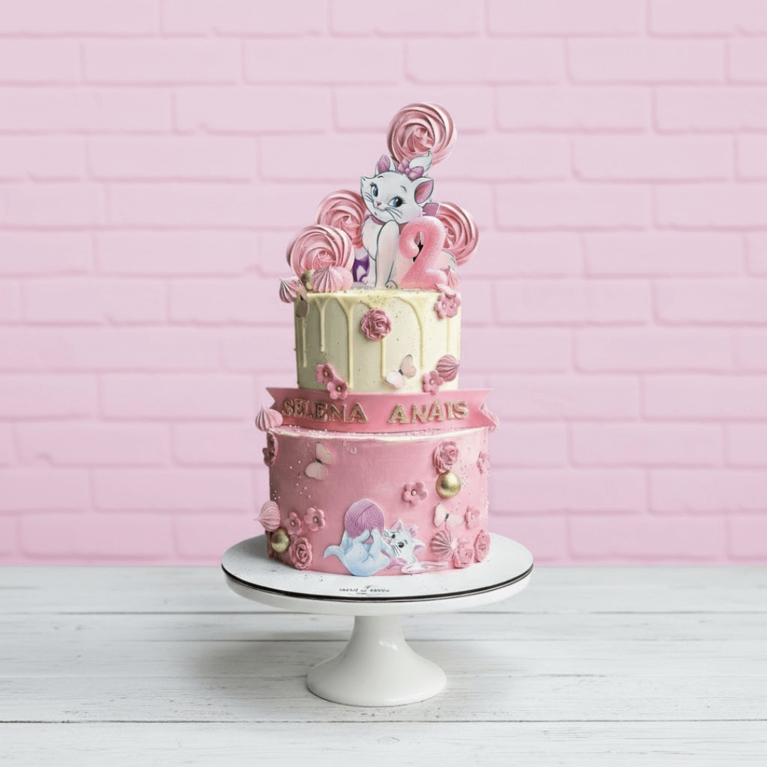 two tiers aristocat theme cake in pink colour for kids birthdays