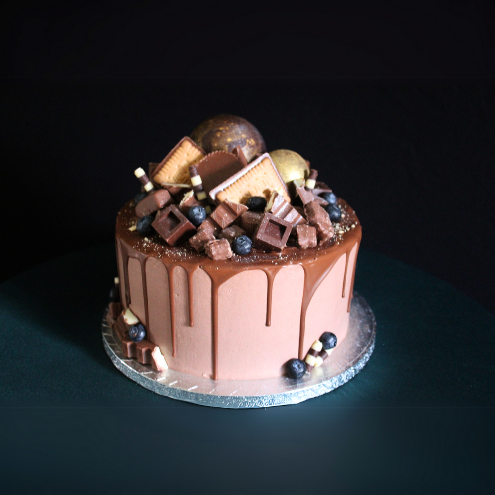 2 in 1 Coffee Cake with Cheesecake layered with espresso sponge and creamy cheesecake, topped with coffee buttercream.