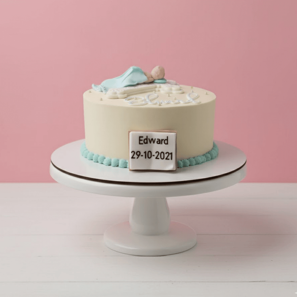 baby birthday cake with decorative elements on a white stand against a pink background