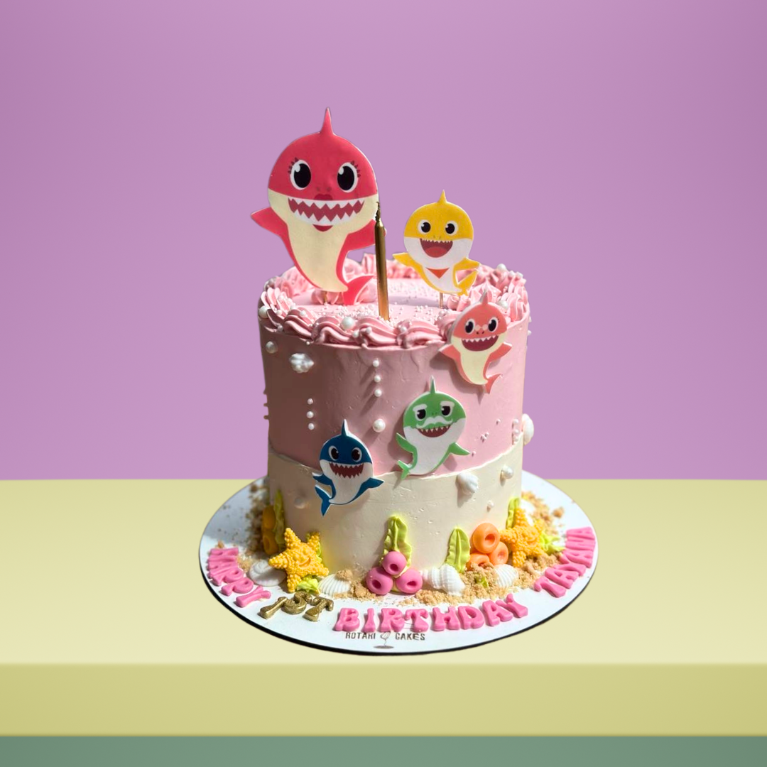 Baby shark theme cake in pinkl colour for kids birthdays