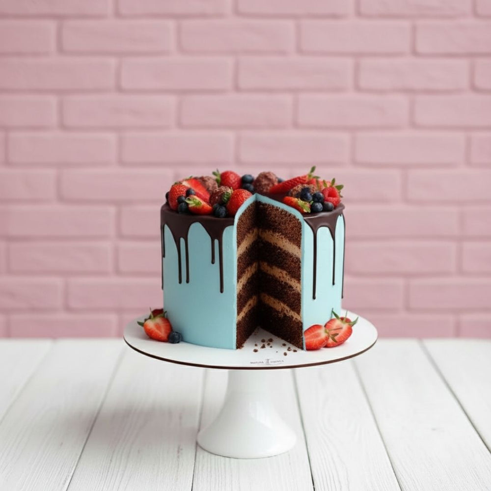chocolate cake blue colour with berries on top