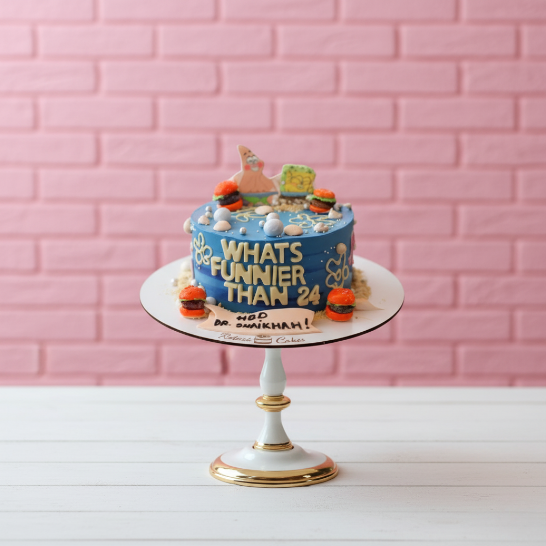 Birthday cake with text and decorations on a white stand against a pink brick wall.