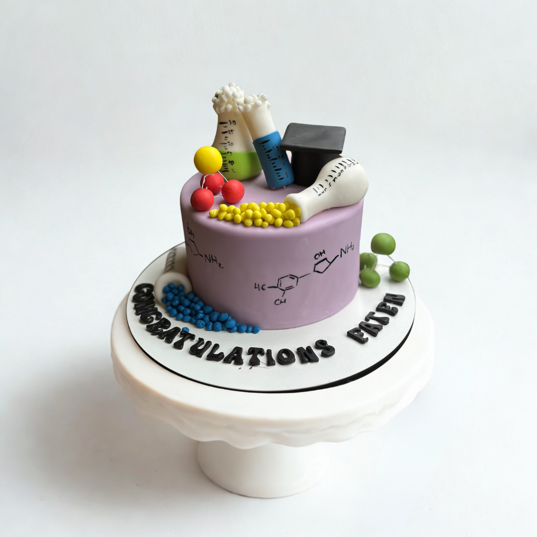 Chemist Graduation Cake with beaker and science-themed decorations ideal for chemistry graduates
