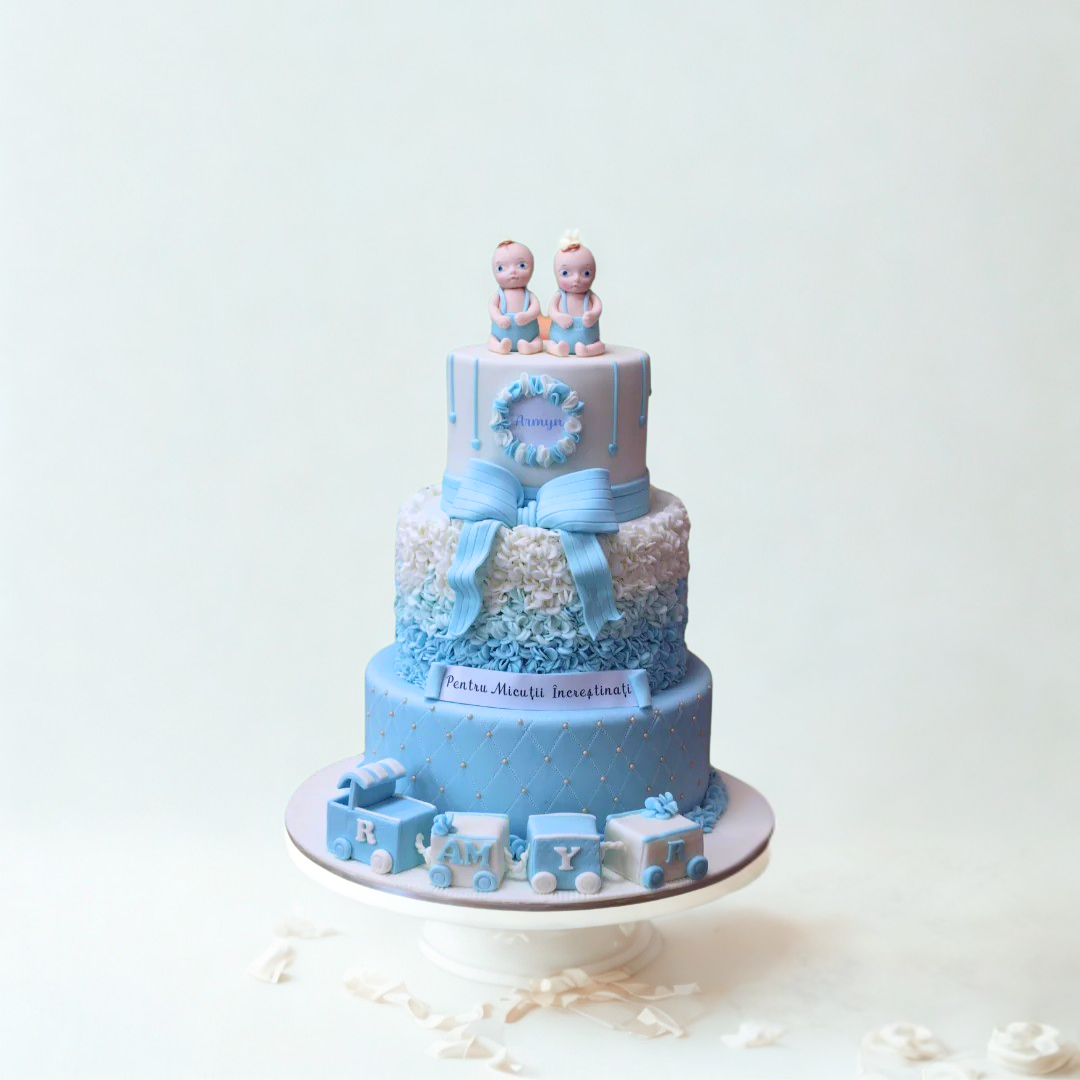 Three-tiered blue baby shower cake with decorative elements of christening
