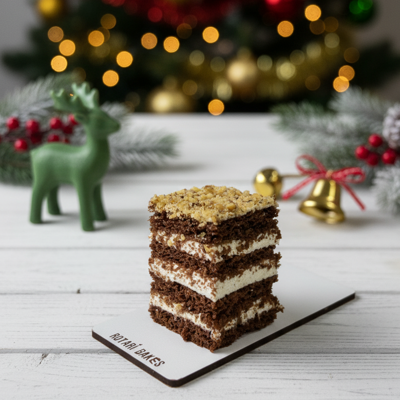 
                  
                    Layered dessert on a white surface with a blurred Christmas tree in the background
                  
                