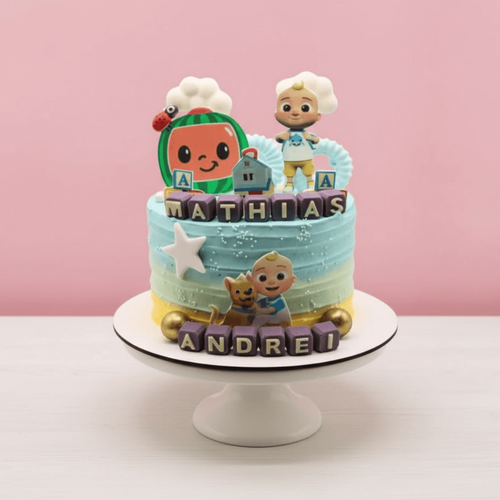 Children's birthday cake with cartoon character figures and colorful frosting on a pink background