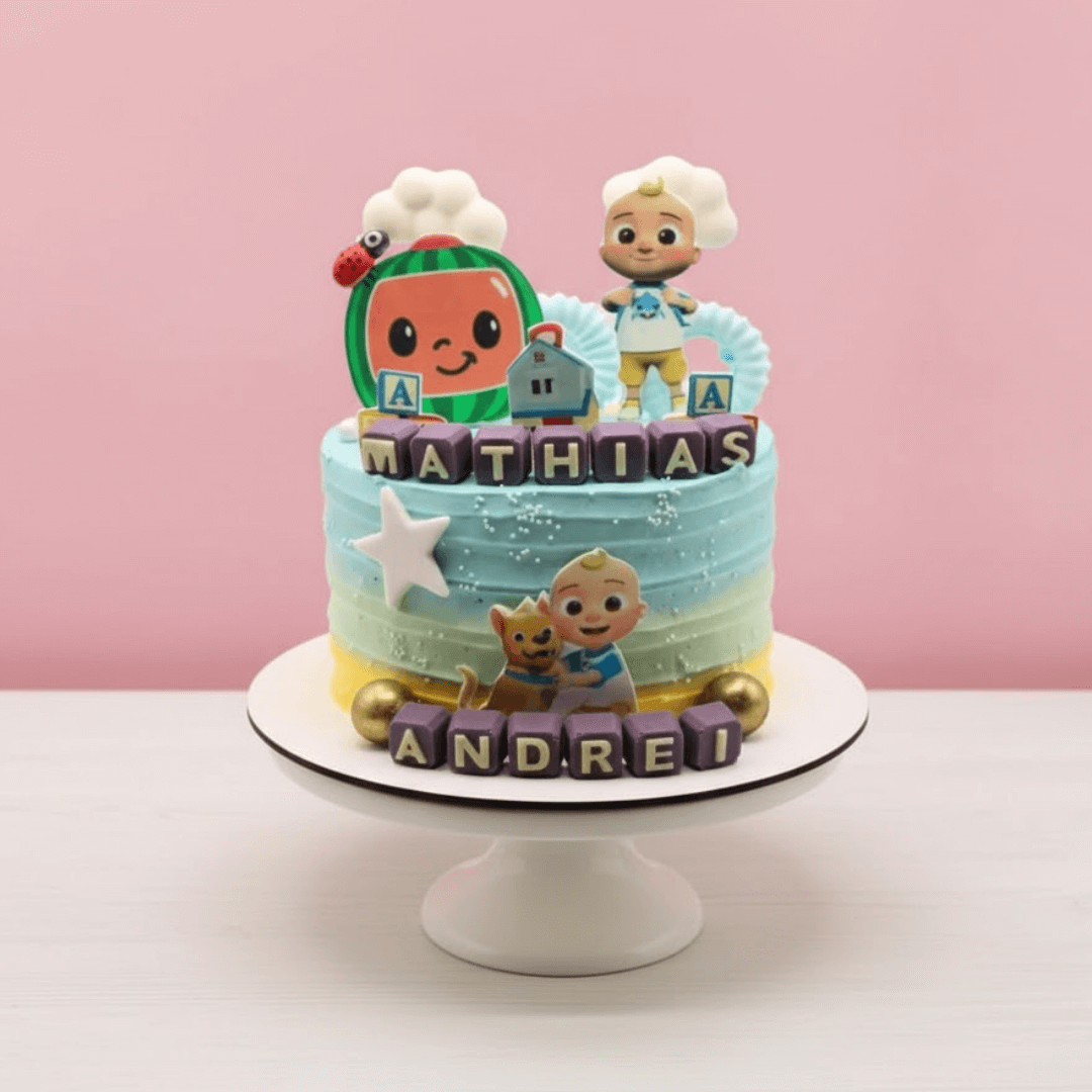 Children's birthday cake with cartoon character figures and colorful frosting on a pink background