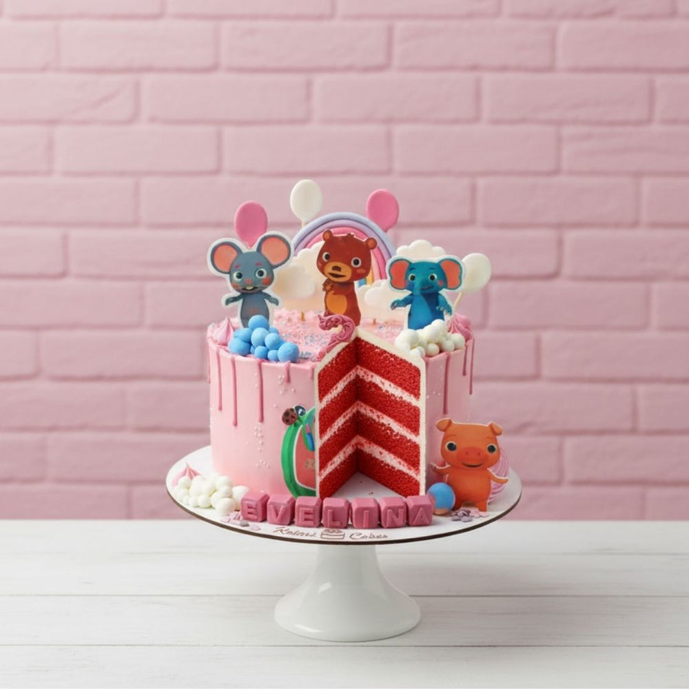 
                  
                    cocomelon theme pink Colorful children's birthday cake with animal-themed decorations on a pink brick background
                  
                