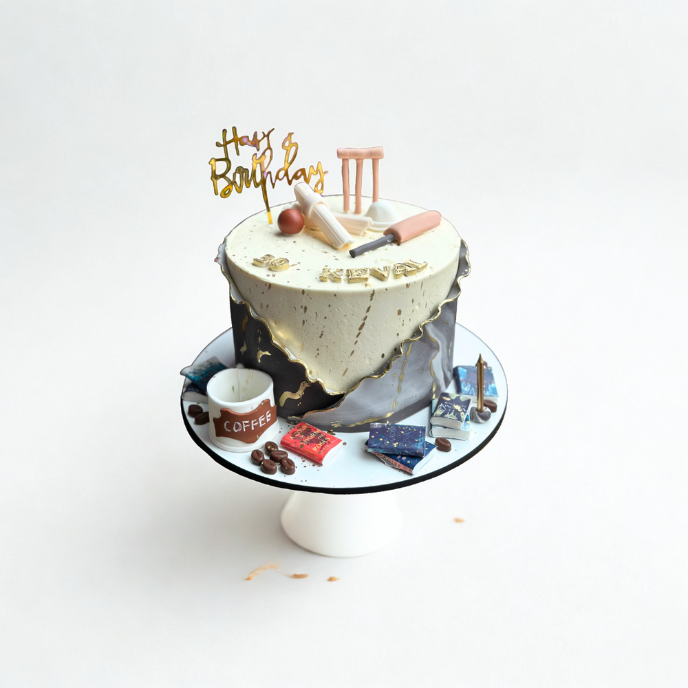 Cricket Lovers Cake with edible bat and ball decorations 