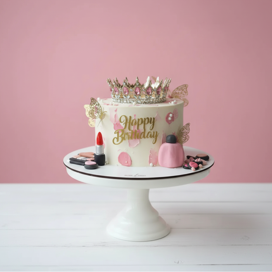 crown theme Birthday cake with decorative elements on a pink background