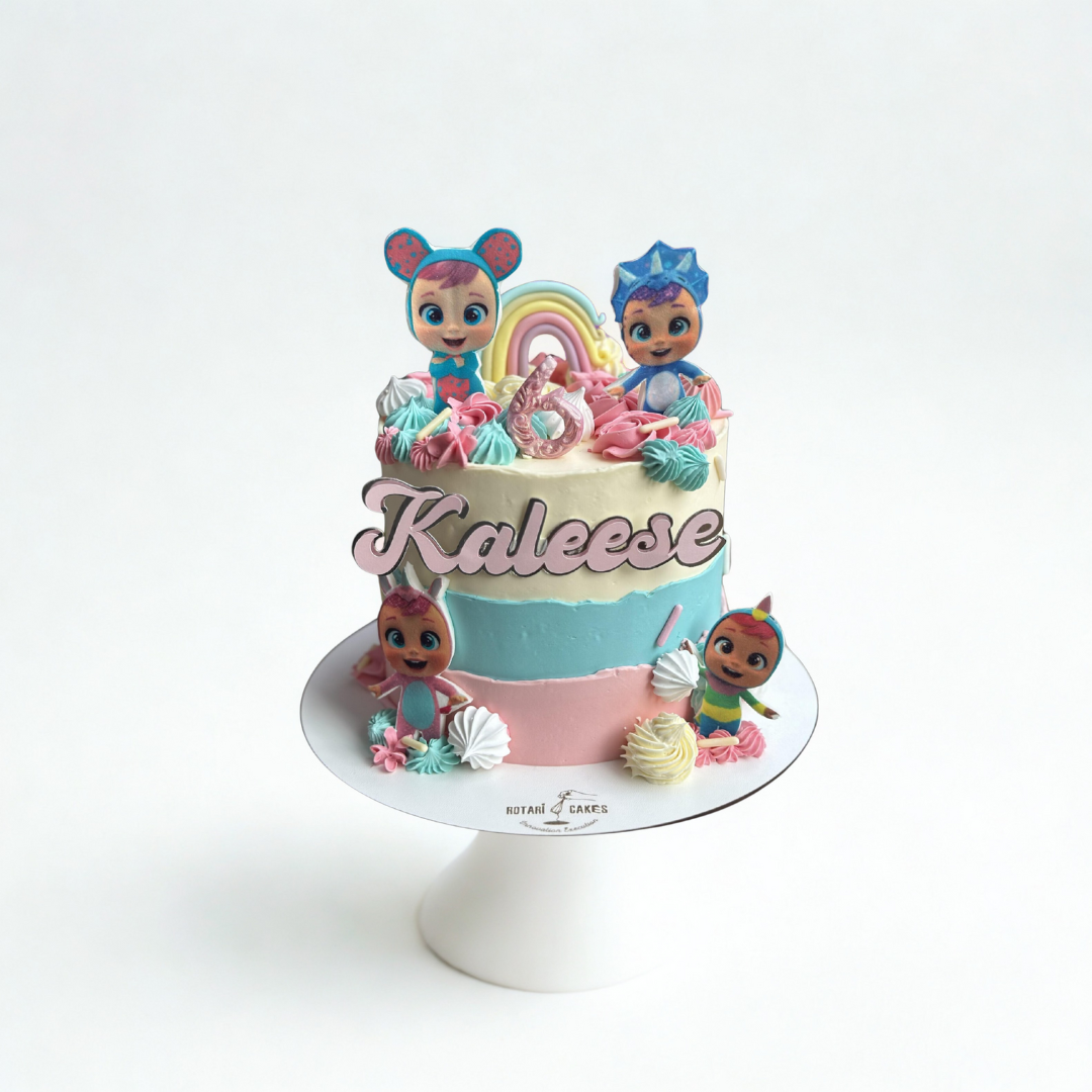 Colorful birthday cake with cry babies theme cartoon character figurines 