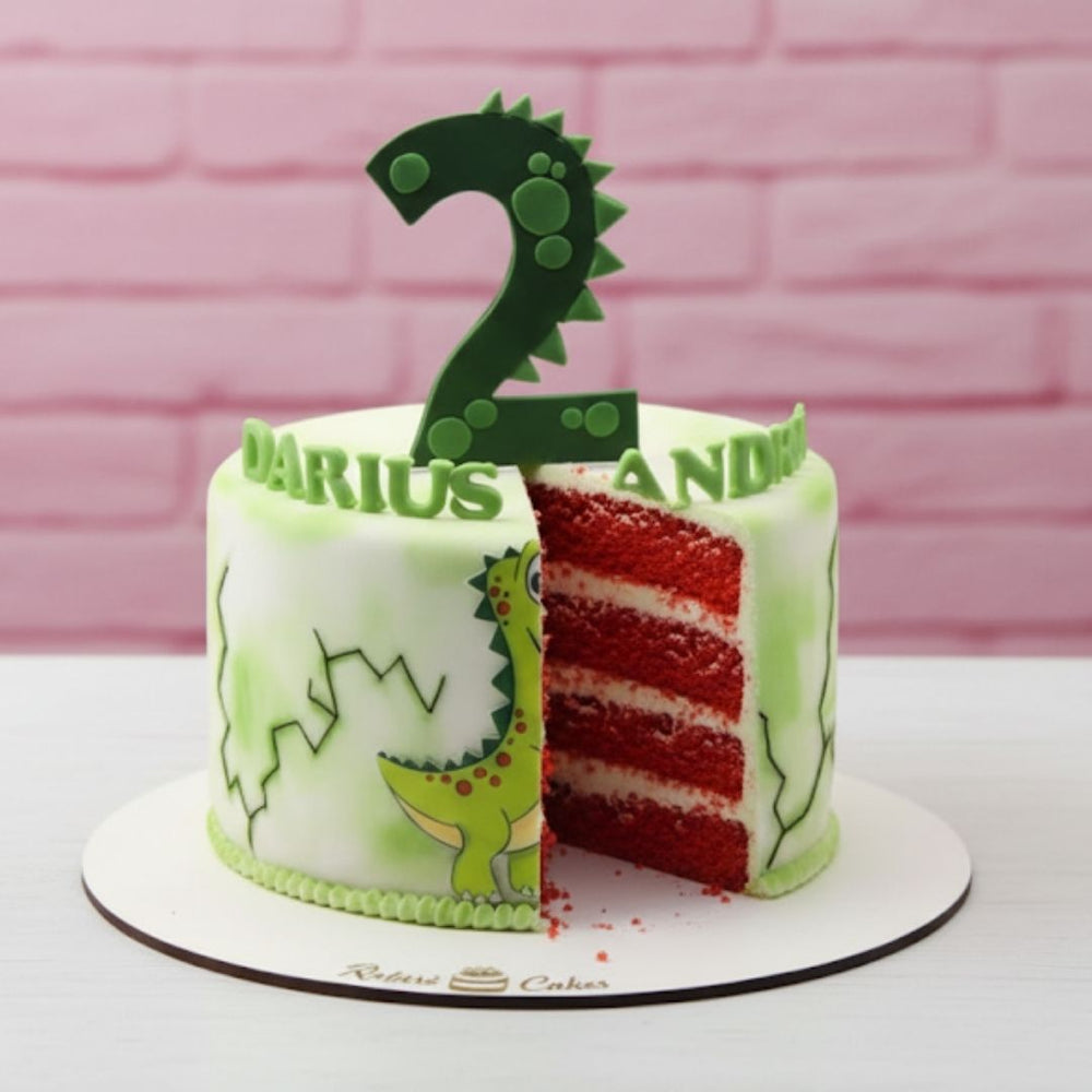 Children's birthday cake with dinosaur design and number 2 cake topper on a pink brick wall background.