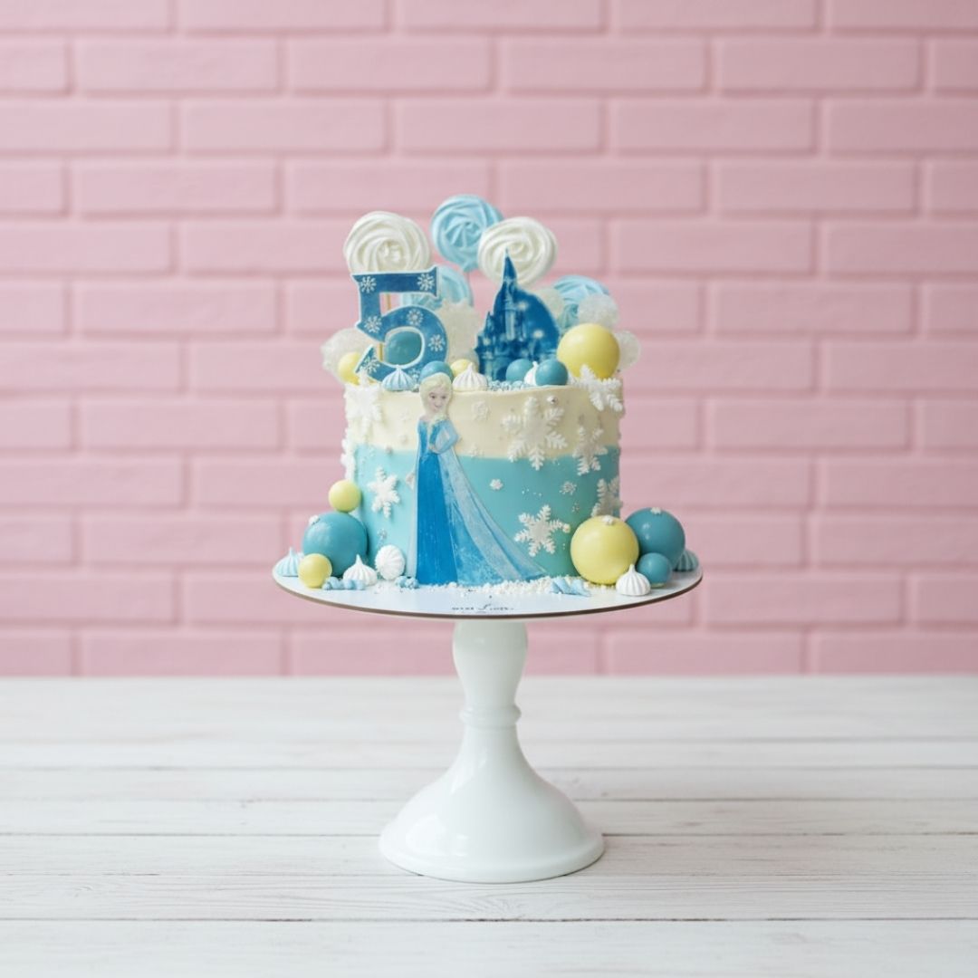 elsa theme Decorative cake with blue and white theme on a pink brick wall background