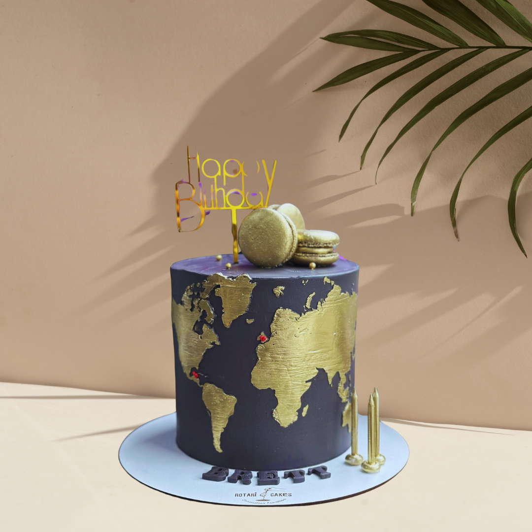 Golden and black map cake for travel-themed events and celebrations.