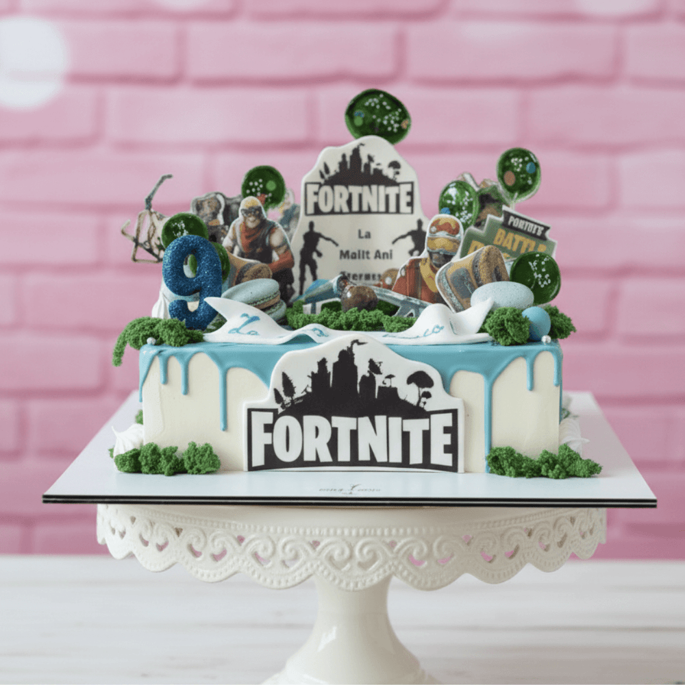 ForteNite-themed birthday cake with character figures and decorations on a pink background