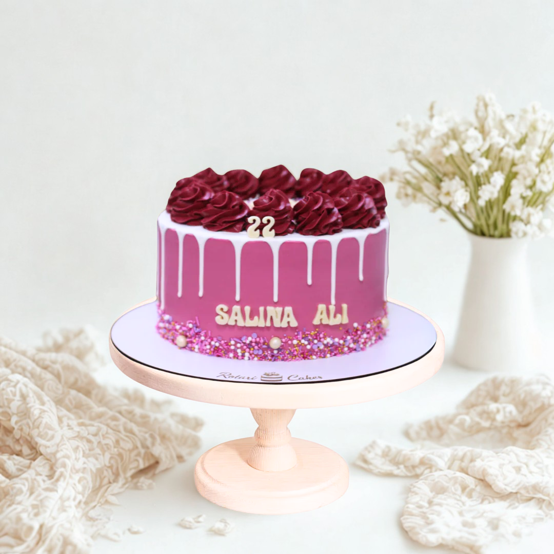 Pink cake with floral decorations for girls