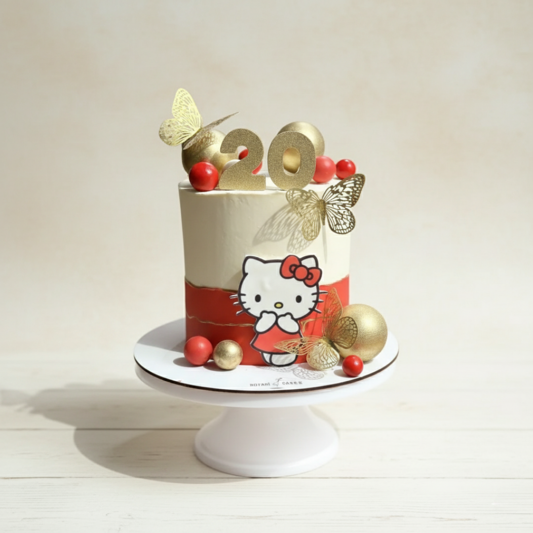 hello kitty theme cake in golden and red colour combination