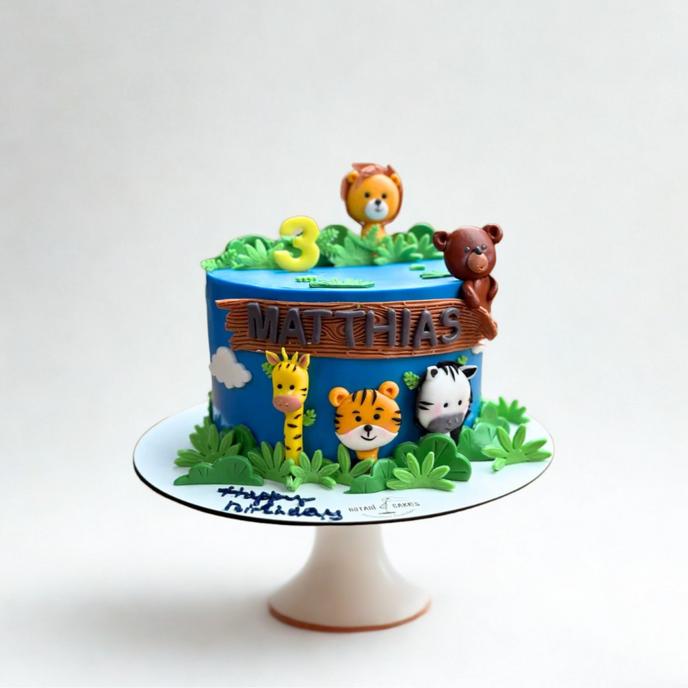 jungle theme cake with animals for kids birthdays