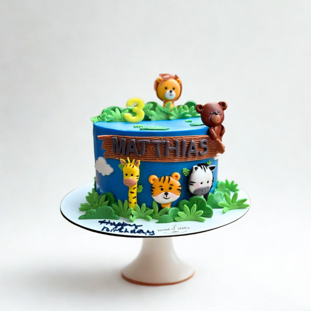 jungle theme cake with animals for kids birthdays