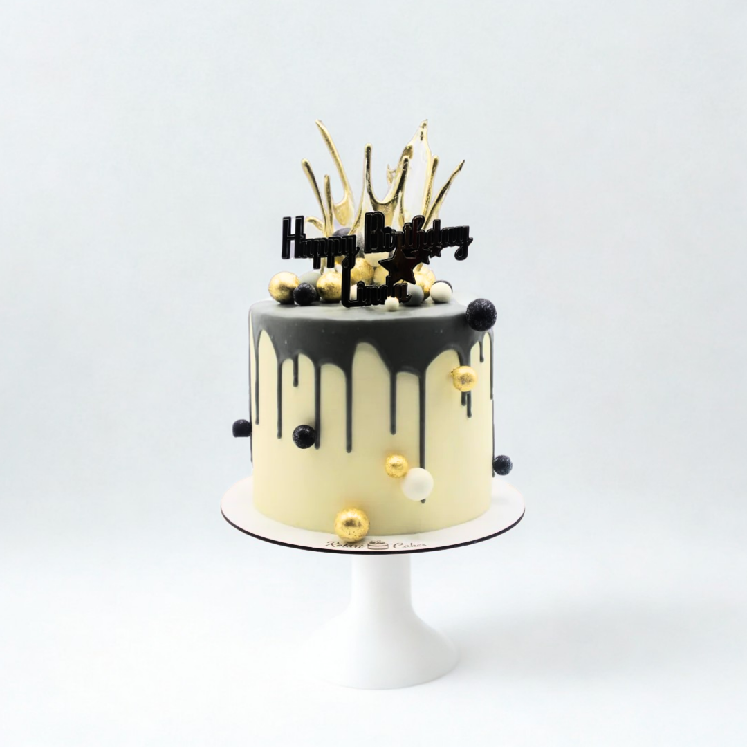 milky cake with black and gold elements for girls birthday