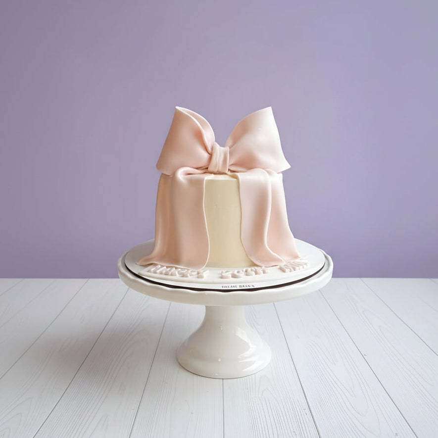 mini bow cake in pink colour for birthdays and other occasions