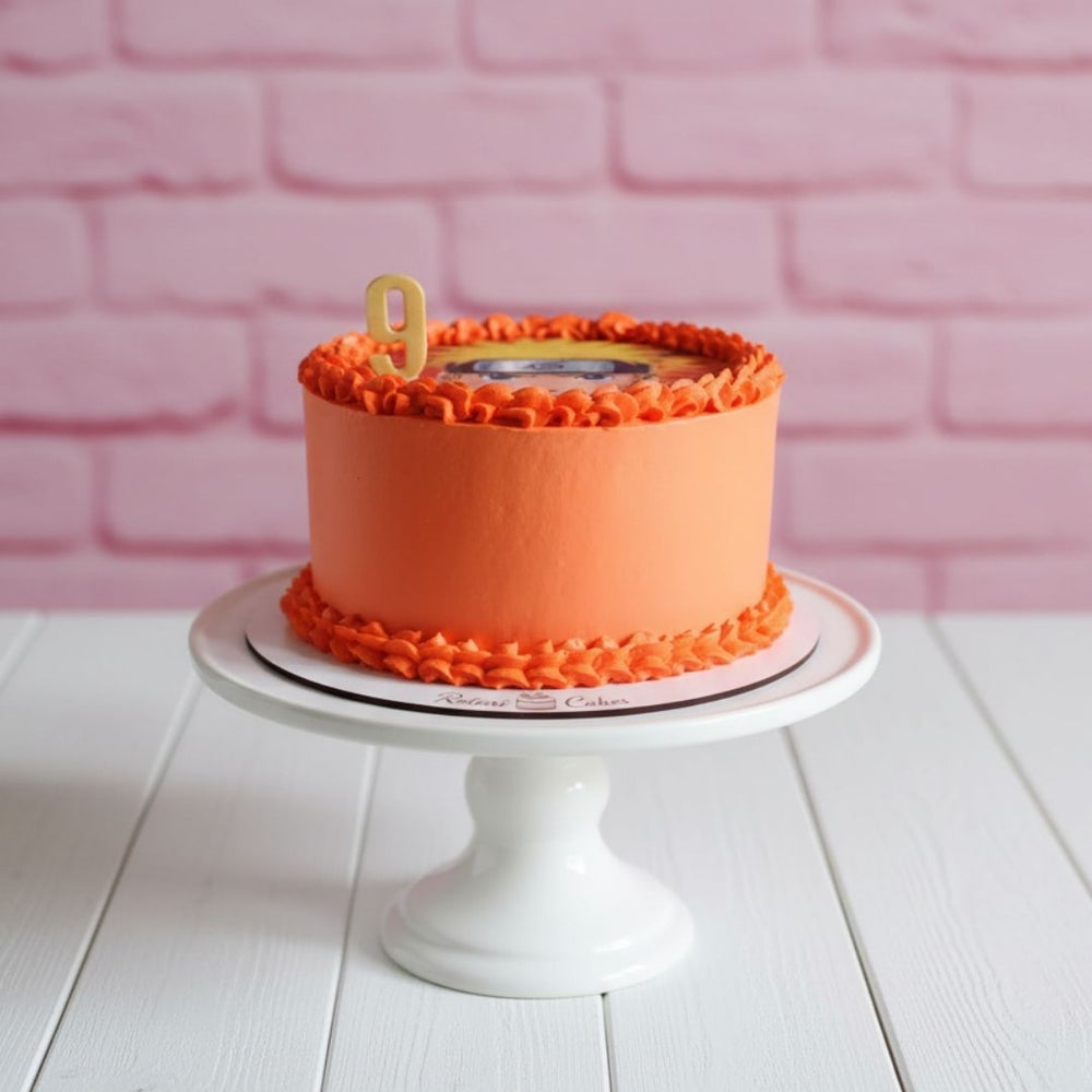 
                  
                    naruto theme cake in orange colour with naruto image on top
                  
                