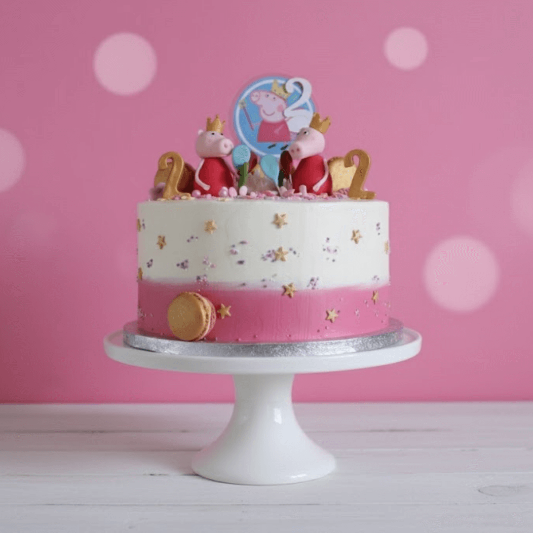Birthday cake with Peppa Pig-themed decorations on a pink background
