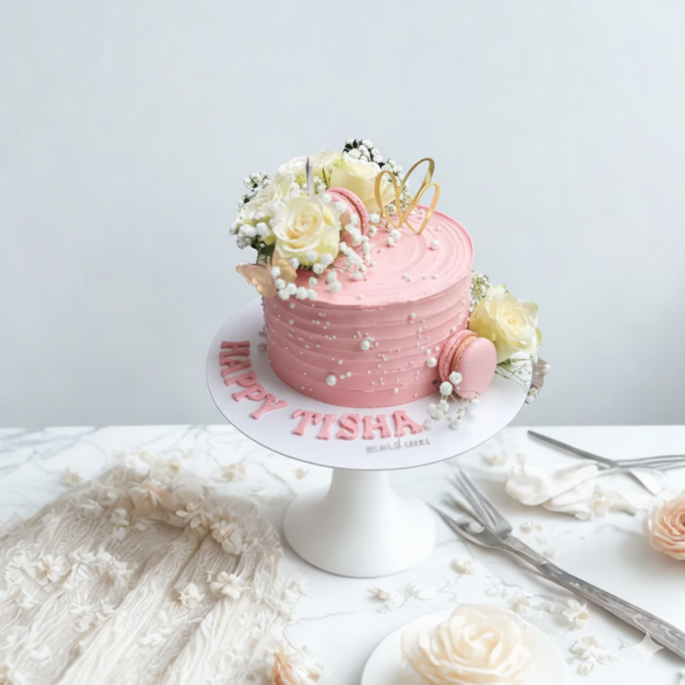 
                  
                    Pink cake with floral decorations on a white stand against a light gray background
                  
                