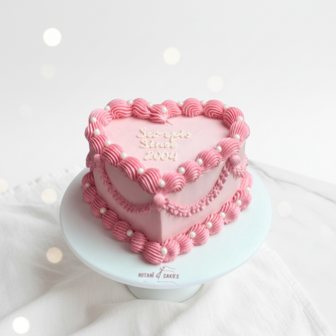 pink colour heart shape cake with piping and vintage design