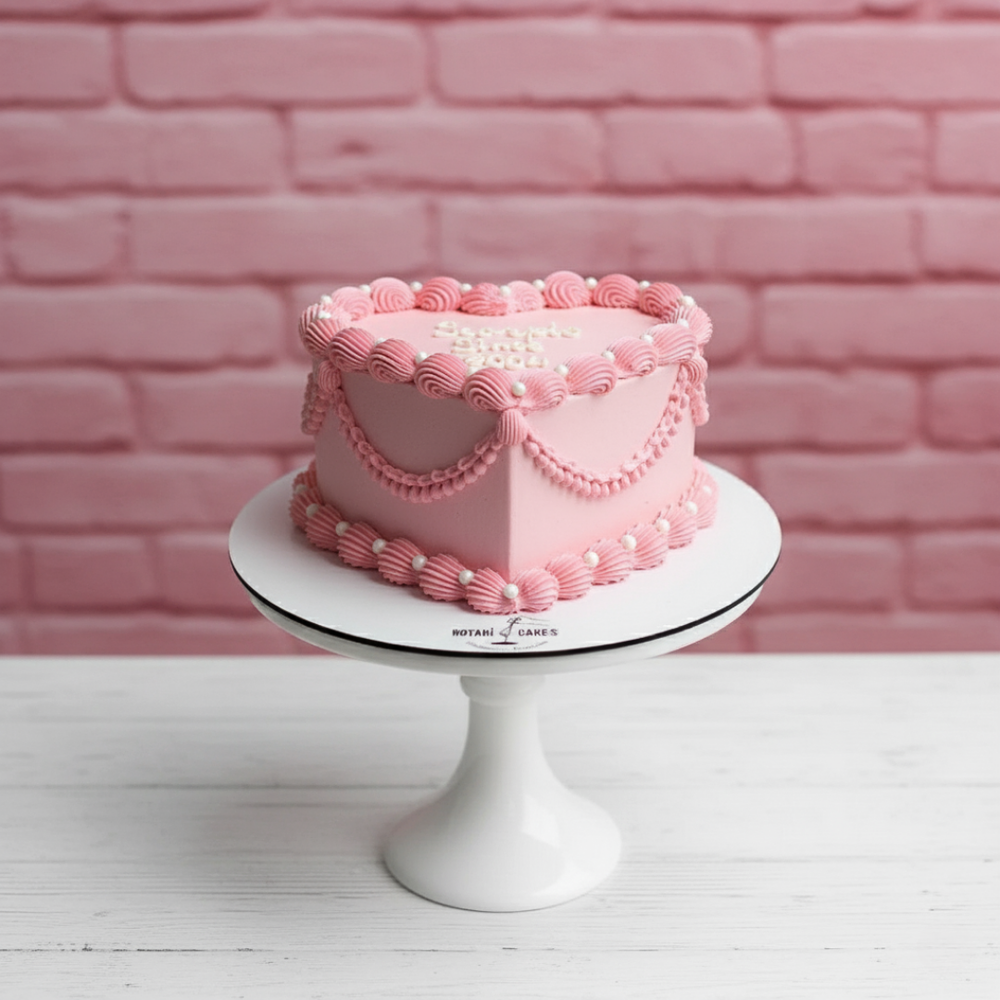 pink colour heart shape cake with piping and vintage design