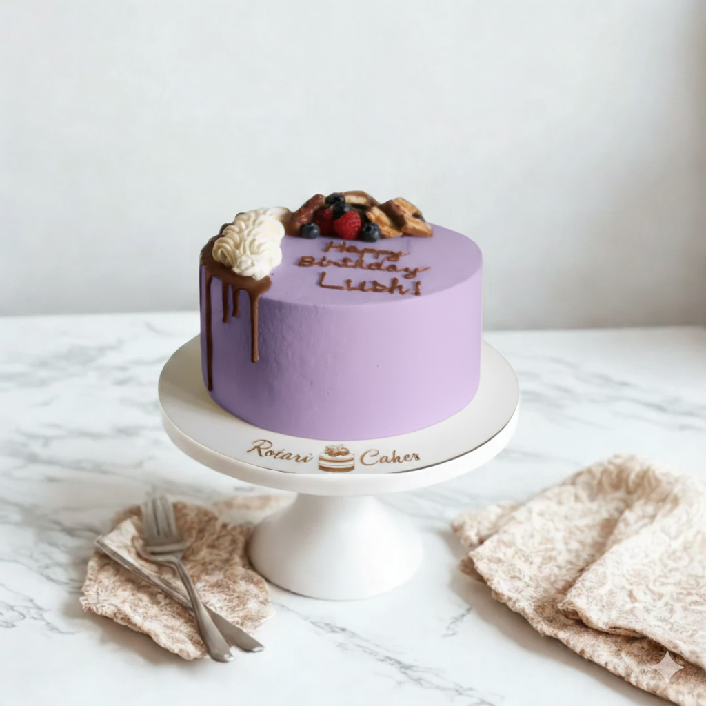 Purple birthday cake with fruit toppings on a white marble surface