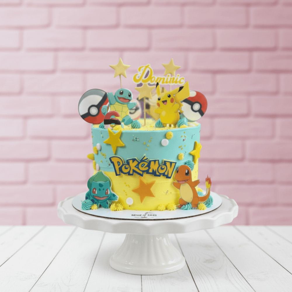 Pokémon-themed birthday cake with character toppers on a white stand against a pink brick wall.