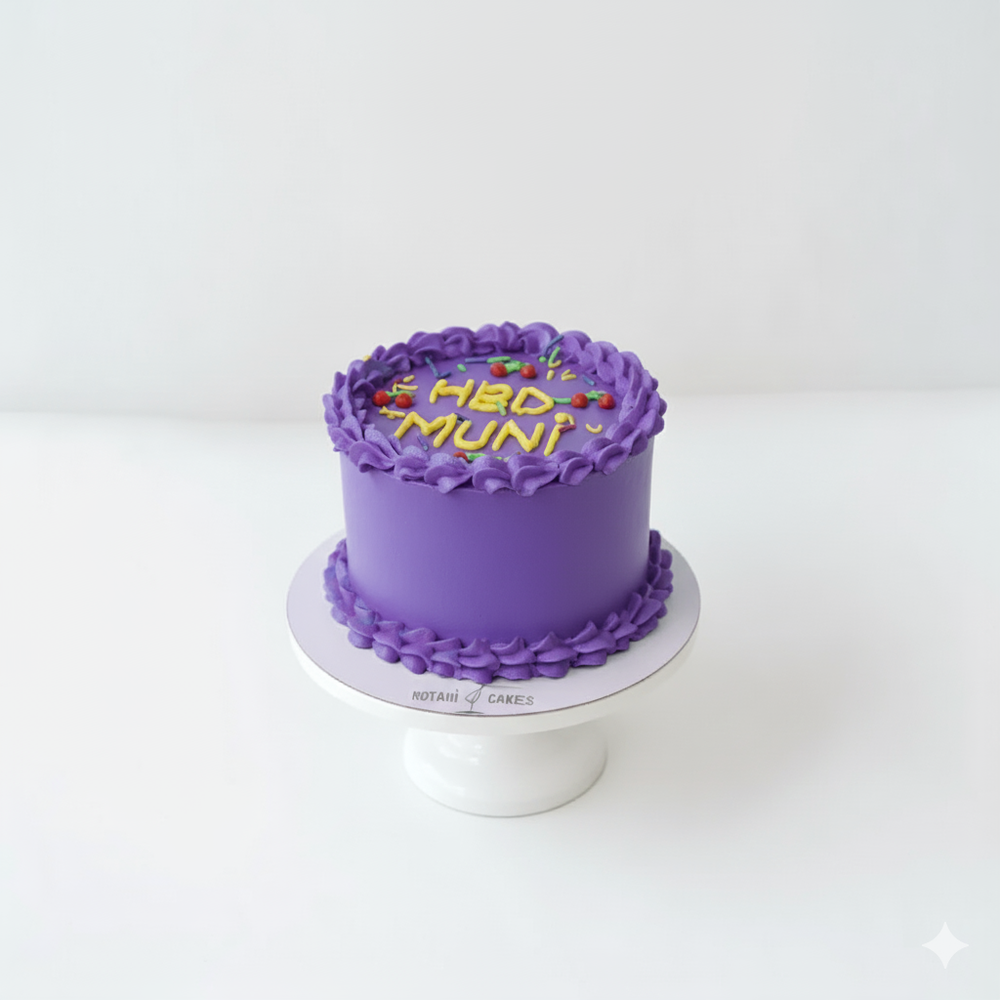 
                  
                    Purple cake with 'MED MUN!' text on a white stand against a white background
                  
                