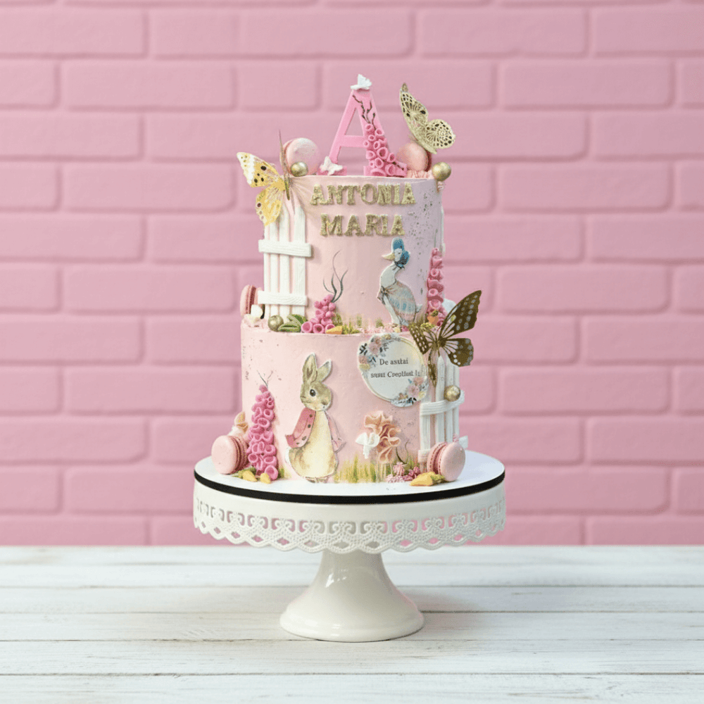 Rabbit theme two tier cake in pink colour for kids and girls birthdays