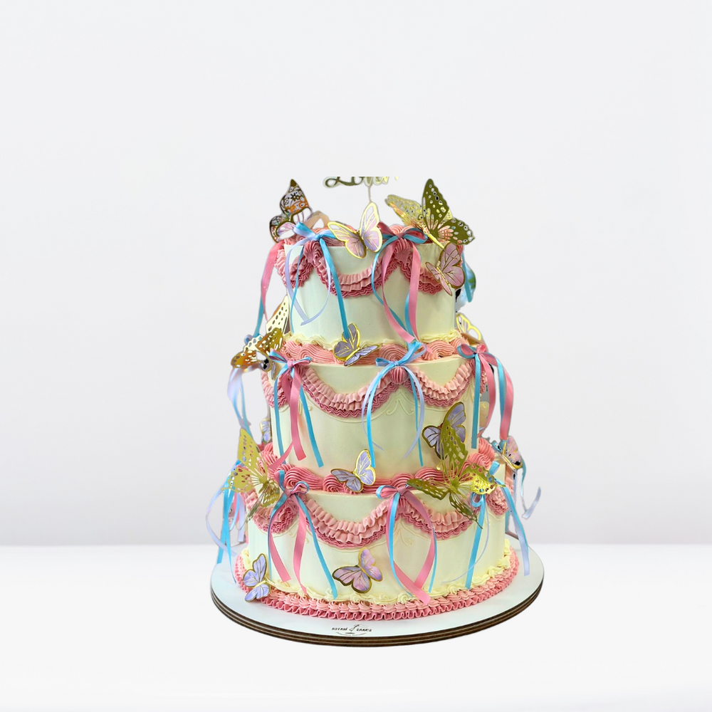 Rustic-style cake featuring natural textures and butterfly decorations for elegant celebrations