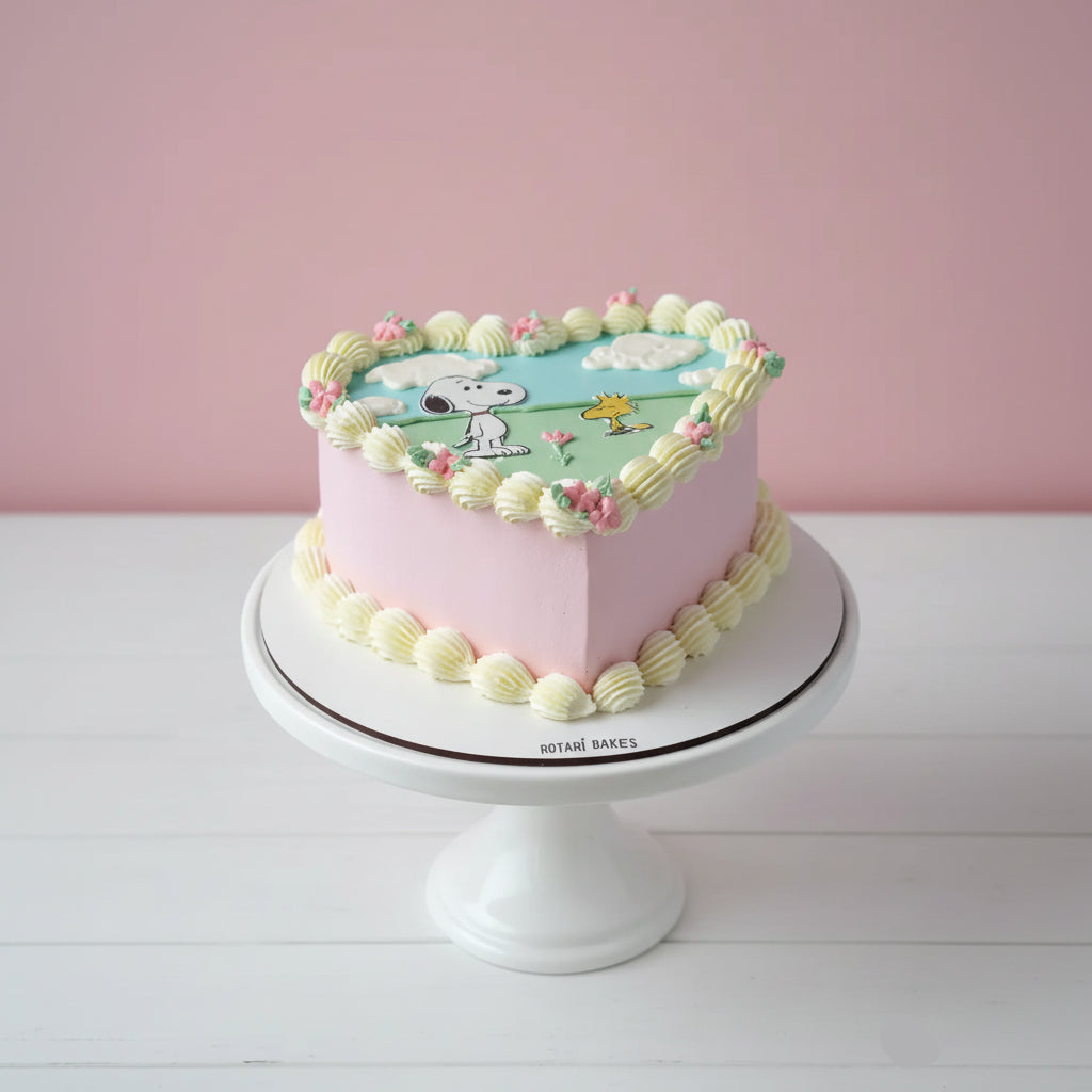 snoopy cake heart shape in pink and white colour for birthdays in Nottingham 