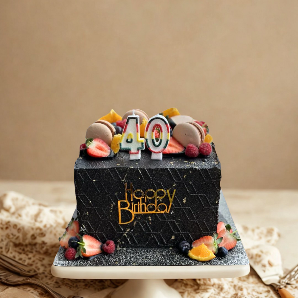 Black birthday cake with 'Happy Birthday' and number '40' on a beige background