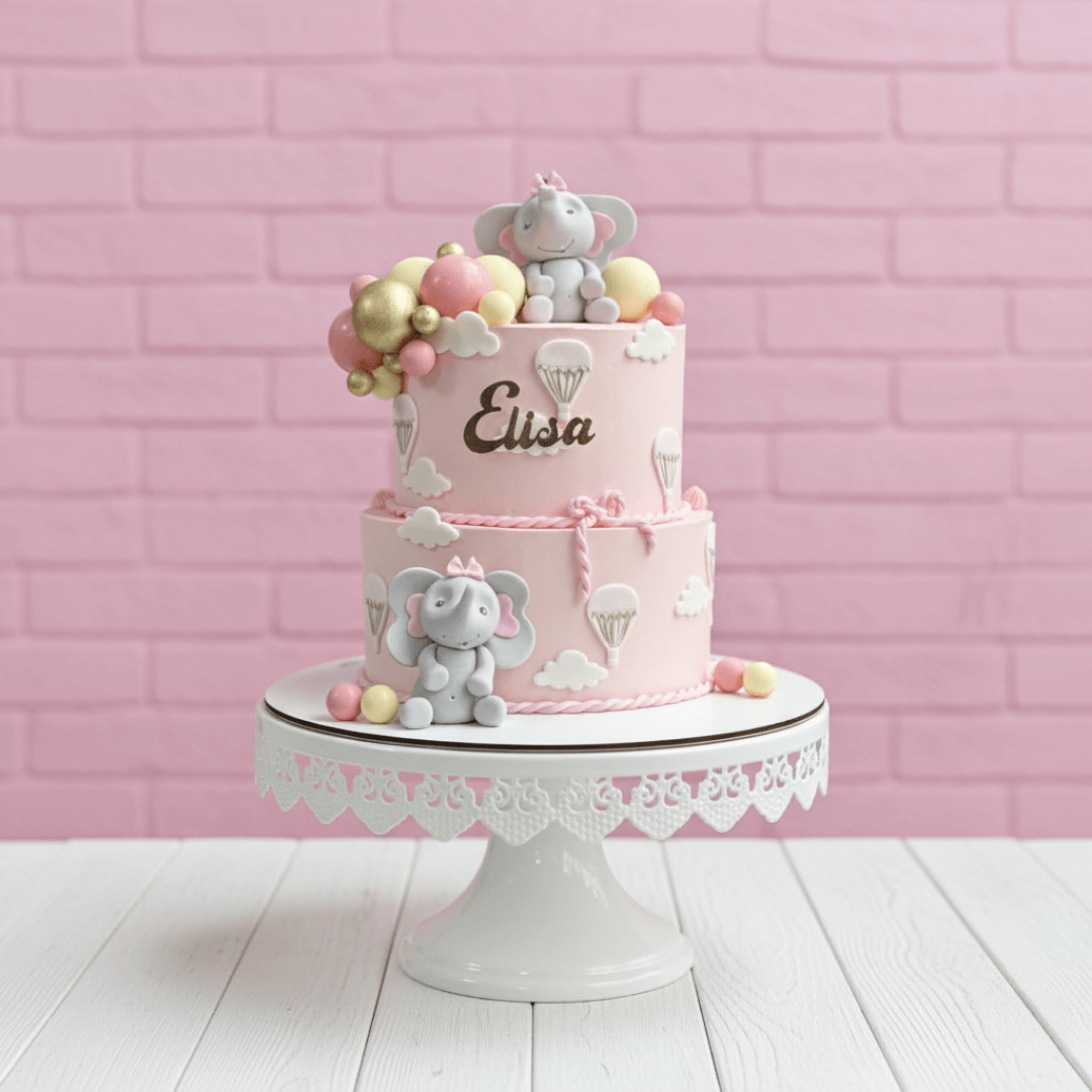 Two-tiered birthday cake with elephant decorations on a pink brick wall background